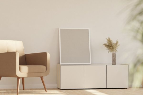 a chair sitting next to a white cabinet in a room
